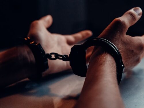 hands bound by handcuffs